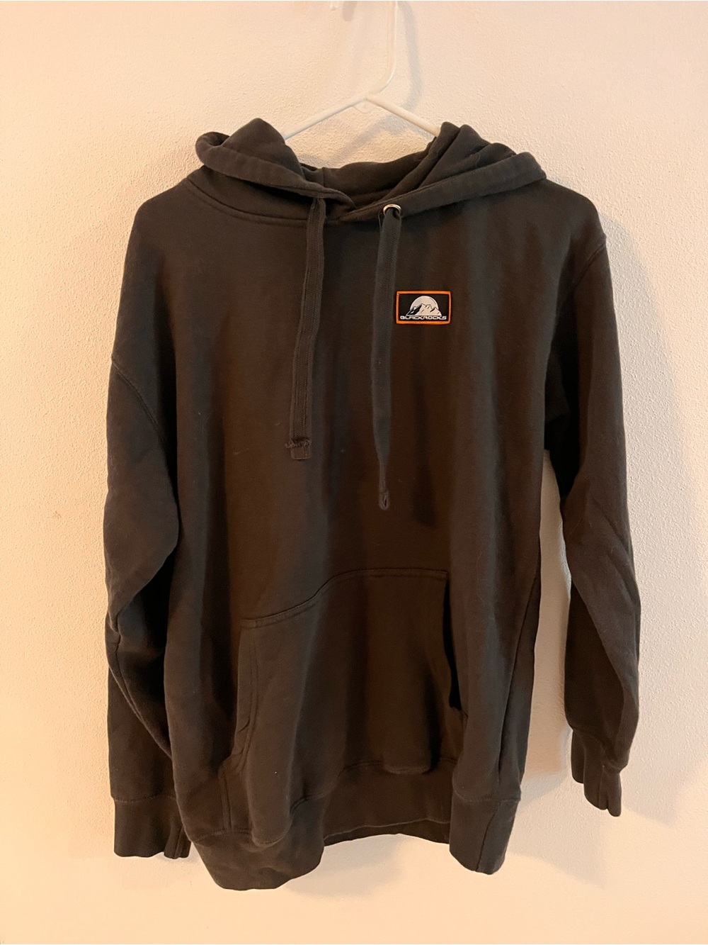 Unisex Black Pullover Hoodie with Small Chest Patch